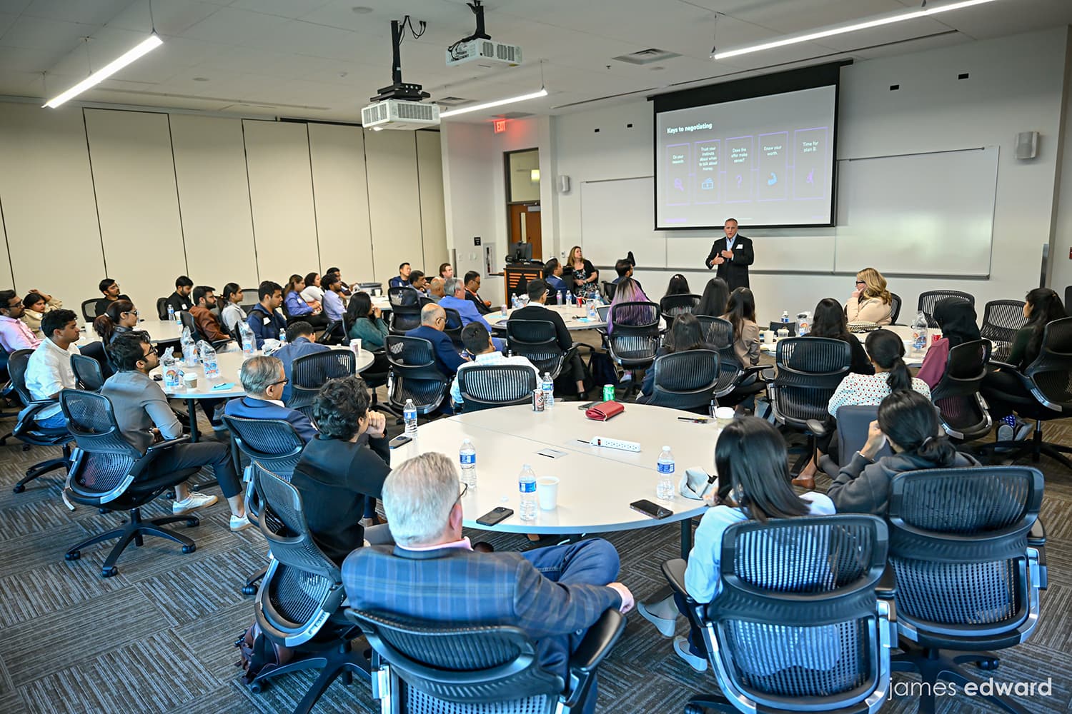 Mentors working with students at a career workshop